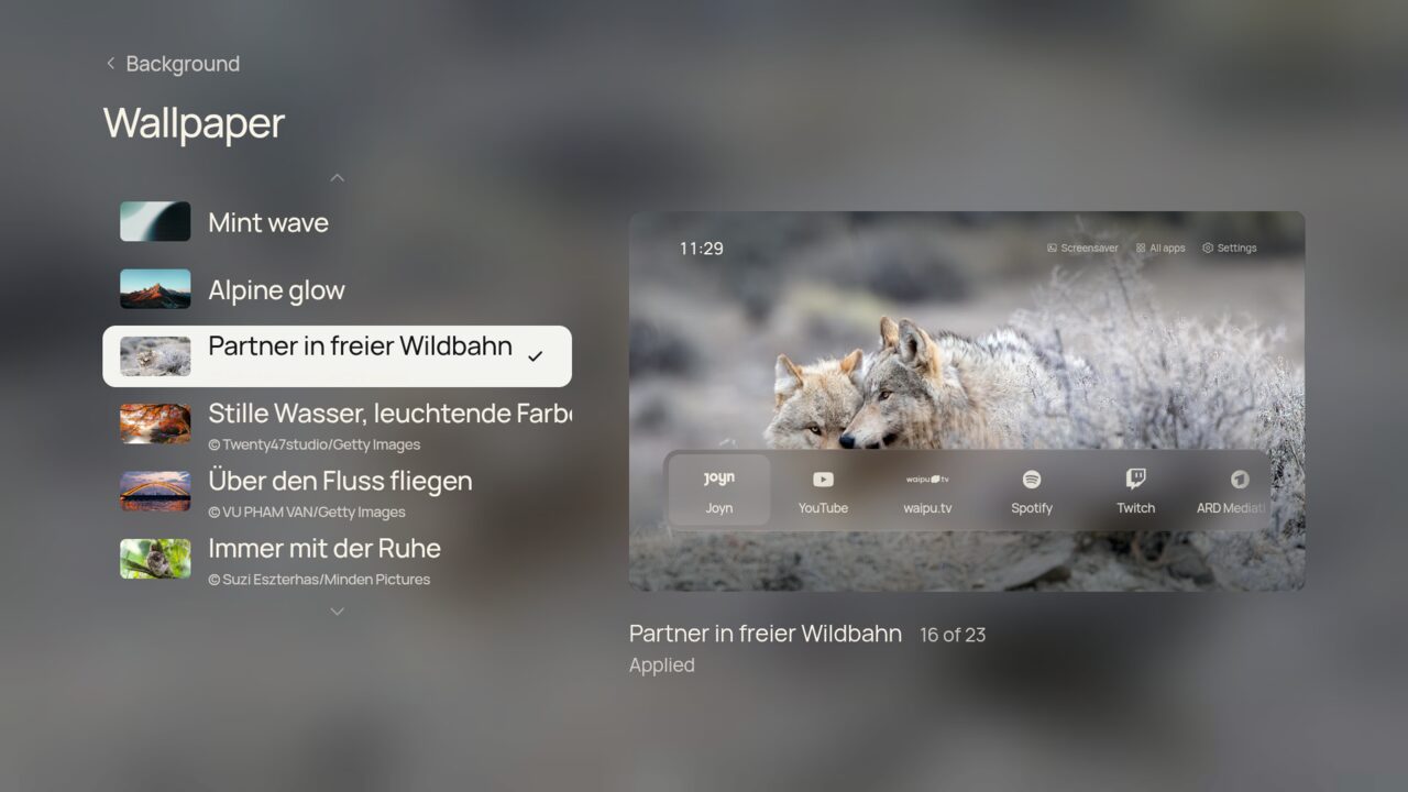 Wallpaper gallery with a list of photos and their credits beside a preview
